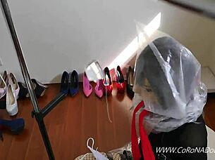 doll plays self-bondage in latex catsuit outdoors