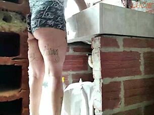 i sneaked into my neighbor's house hid to watch her ass washing clothes she caught me and we went crazy fucking in her yard