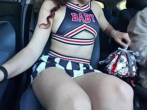 A young cheerleader enjoys intimate fingering during a car ride home
