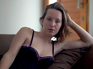 Beautiful petite brunette babe with blue eyes smokes teasingly in voyeur view