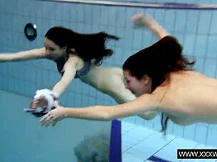 oh god, this shaved big tits brunette teases underwater!