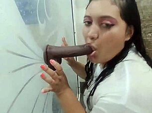 playing in bathroom wearing tight shirt while fingering wildly