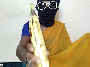 south indian auntie stuffs big banana in pussy
