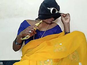 south indian auntie stuffs big banana in pussy