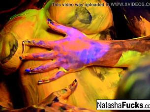 Busty brunette Natasha Nice glows in sexy black light solo tit tease