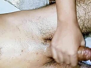 oiled indian beauty massages throbbing big dick with intense handjob passion
