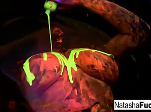 Busty brunette Natasha Nice glows in sexy black light solo tit tease