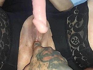 ohh dulces... my vagina feels so good masturbating with this big dildo on bed in fishnets tattooed legs spread wide