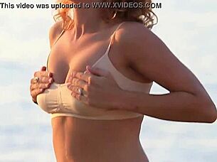 lady's soft breasts bounce gently in bra while clothed