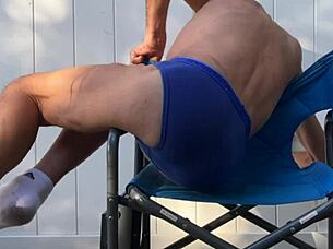 skinny girl stretches deep in blue briefs flashing socks