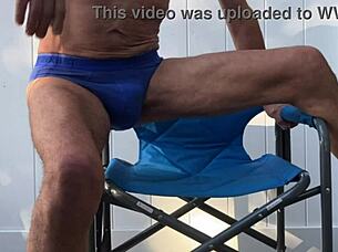 skinny girl stretches deep in blue briefs flashing socks