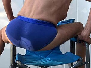 skinny girl stretches deep in blue briefs flashing socks