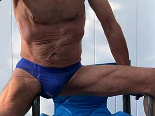 skinny girl stretches deep in blue briefs flashing socks