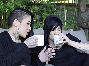 Beautiful tattooed lesbo licks heels sucks shaved pussy strapon fucks