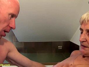 83-year-old hairy mature gets her pussy roughly fingered in kitchen