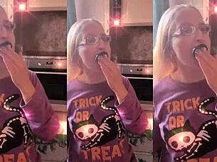 blonde with glasses brushes her long hair intimately using a lollipop in asmr session