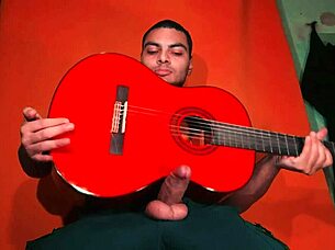 sexy chinese bodybuilder rubs spanish guitar on monster cock carrot background! 🎸🍆