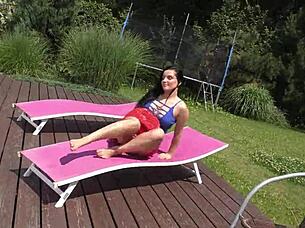 She teases garden breeze under short skirt