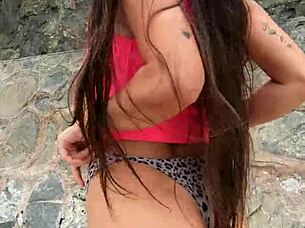 Petite beach babe flashes bikini dance publicly!