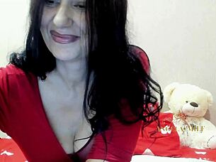 passionate brunette milf undresses rips clothes plays with huge milky tits