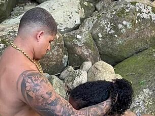 brazilian tattooed hottie fucks young stud at waterfall