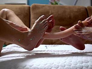 Hey cuties, shiny legs wrapped around huge rubber cock for steamy footjob fun!