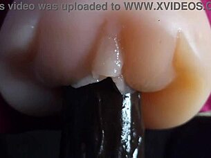 oiled big black dildo pounds fuck doll slow motion closeup