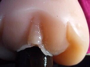 oiled big black dildo pounds fuck doll slow motion closeup