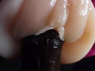 oiled big black dildo pounds fuck doll slow motion closeup