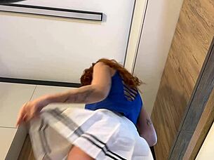 redhead wife flaunts miniskirt and pink panties strip