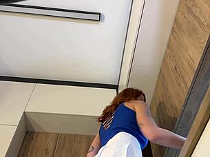 redhead wife flaunts miniskirt and pink panties strip