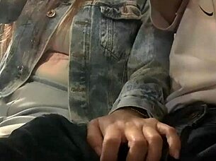 Bus slut grabs my cock and strokes it publicly