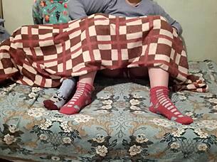 Mutual masturbation under covers while parents watch movie nearby