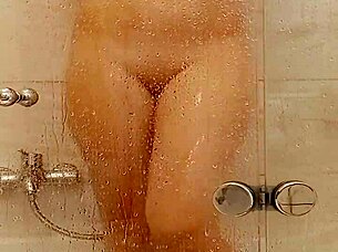 She caresses herself relaxing in the bath