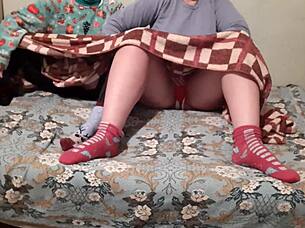 Mutual masturbation under covers while parents watch movie nearby