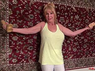 Mature's riding that huge dildo deep