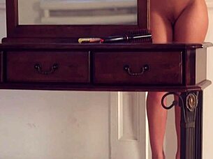 dark haired cutie gropes shaved tits in mirror sensually