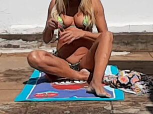 Hot blonde milf spots neighbor filming her naked pussy in the garden