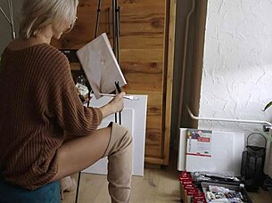 Beautiful babe in boots paints pretty flower design