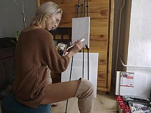 Beautiful babe in boots paints pretty flower design