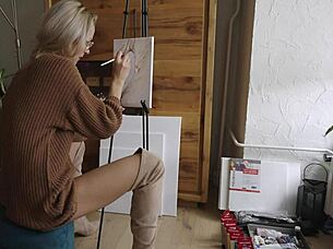 Beautiful babe in boots paints pretty flower design