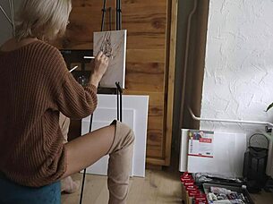 Beautiful babe in boots paints pretty flower design