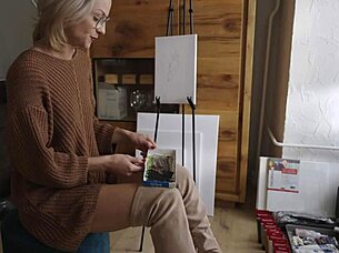 Beautiful babe in boots paints pretty flower design