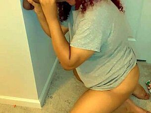 Kneeling to suck that massive BBC dildo deep