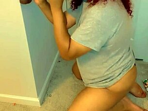 Kneeling to suck that massive BBC dildo deep