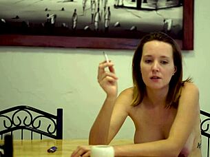 cheeky brunette babe smokes with big tits tease