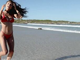 gorgeous brunette gloria sol strips outdoors on beach