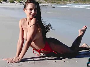gorgeous brunette gloria sol strips outdoors on beach