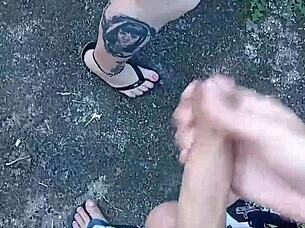 guy delivers blowjob and cumshot in backyard garden