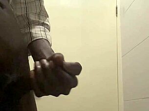 guy caught stroking huge cock in office bathroom